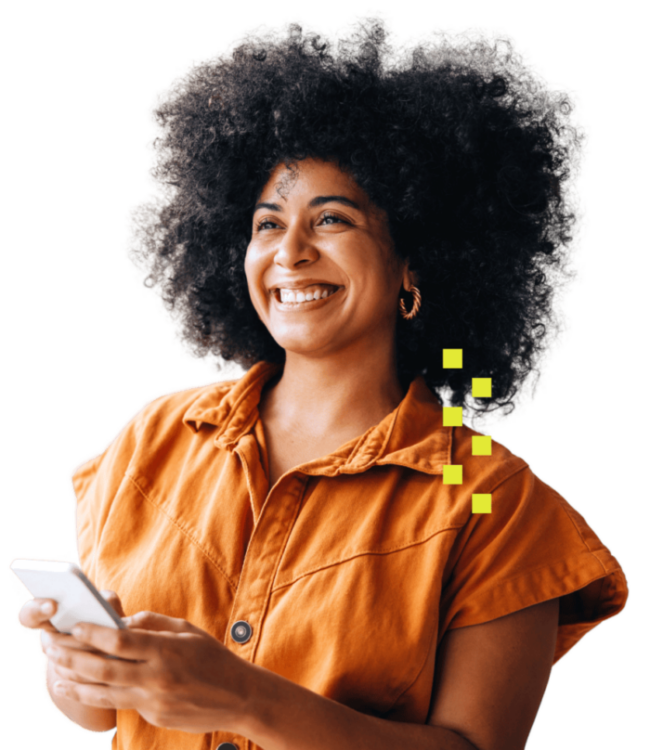 Photo of a smiling Black woman with natural hair holding a cell phone